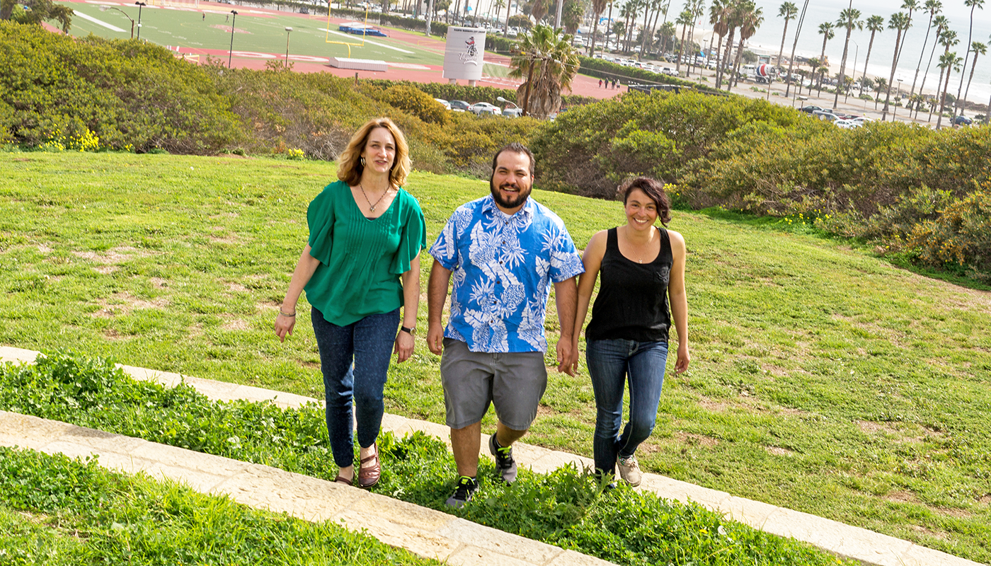 SBCC students walking on campus with la playa stadium in the background.